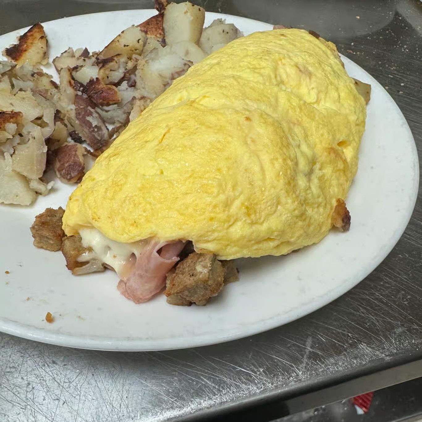 Scrapple Ham, Mushroom, Onion, Provolone Omelete.